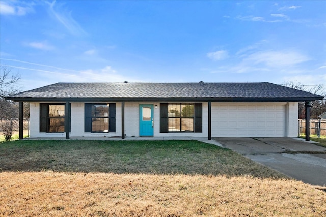 single story home with a front yard and a garage