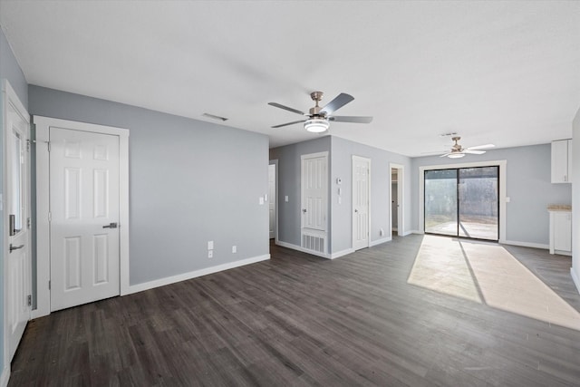 unfurnished living room with ceiling fan and dark hardwood / wood-style flooring