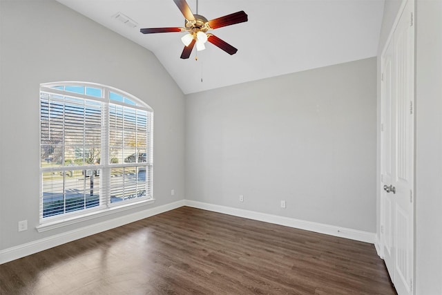 spare room with ceiling fan, dark hardwood / wood-style floors, and lofted ceiling