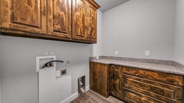 laundry room featuring hookup for an electric dryer, gas dryer hookup, cabinets, and washer hookup