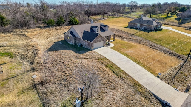 birds eye view of property featuring a rural view