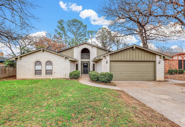 view of front of home with a garage and a front yard