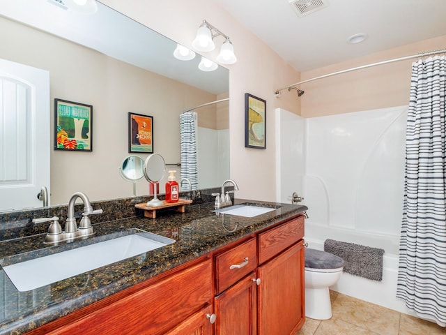 full bathroom with tile patterned flooring, vanity, shower / tub combo, and toilet