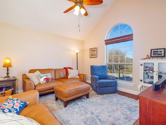 living room with hardwood / wood-style floors, vaulted ceiling, and ceiling fan