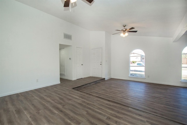 unfurnished living room with ceiling fan, dark hardwood / wood-style flooring, and vaulted ceiling