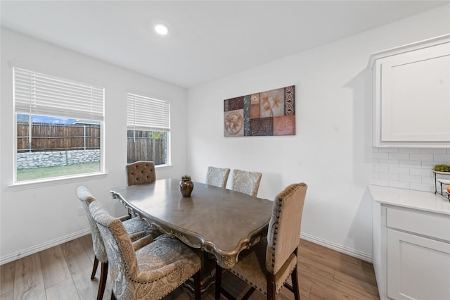 dining room with light hardwood / wood-style floors