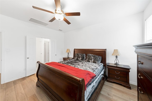 bedroom with ceiling fan and light hardwood / wood-style flooring