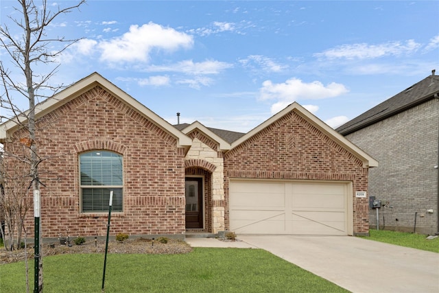 view of front of property with a front yard and a garage