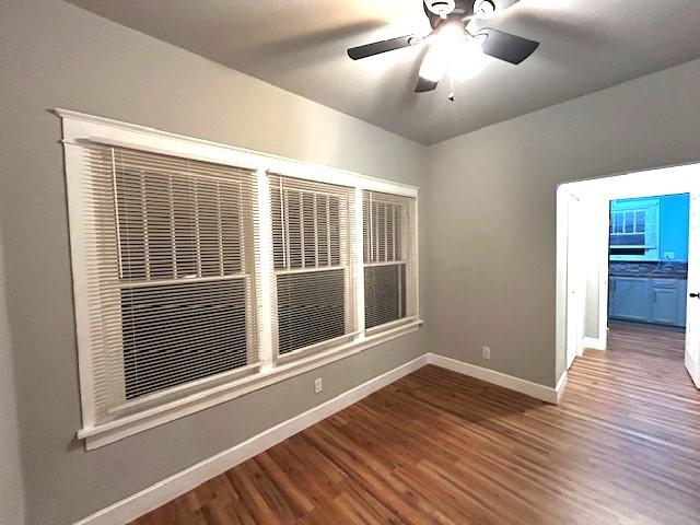 spare room with ceiling fan and hardwood / wood-style floors