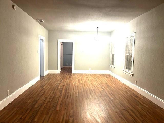 spare room featuring hardwood / wood-style flooring