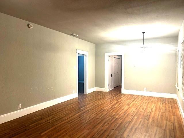 spare room featuring hardwood / wood-style floors