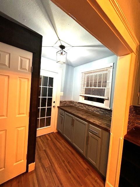 bar featuring dark hardwood / wood-style flooring