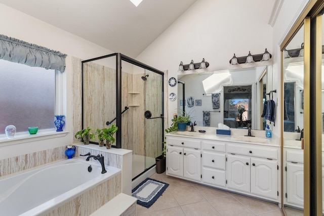 bathroom with tile patterned flooring, vanity, lofted ceiling, and shower with separate bathtub