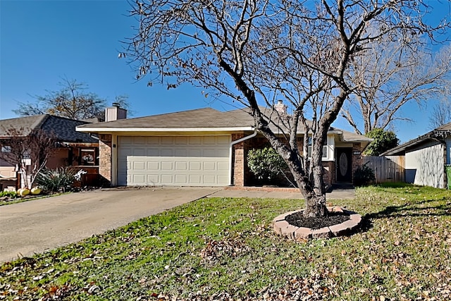 ranch-style home with a front lawn and a garage