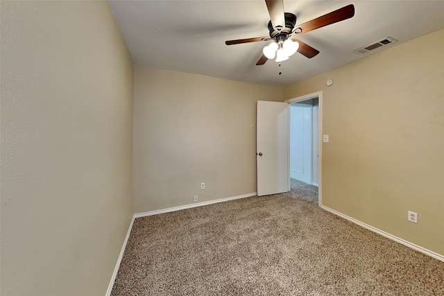 unfurnished room with ceiling fan and carpet flooring