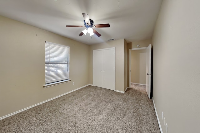 unfurnished bedroom with a closet, ceiling fan, and light colored carpet