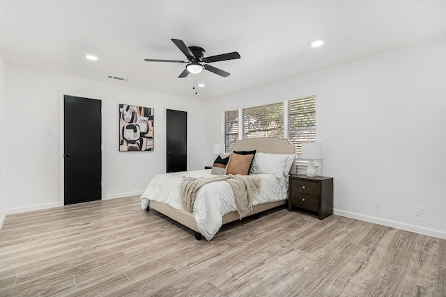 bedroom featuring ceiling fan and light hardwood / wood-style floors