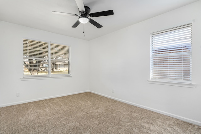 unfurnished room with carpet flooring and ceiling fan