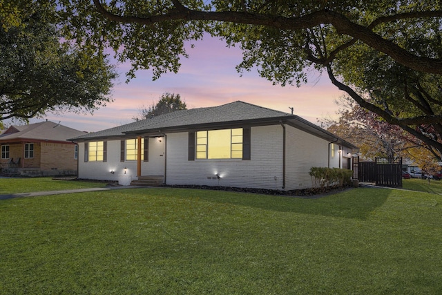 ranch-style house with a yard