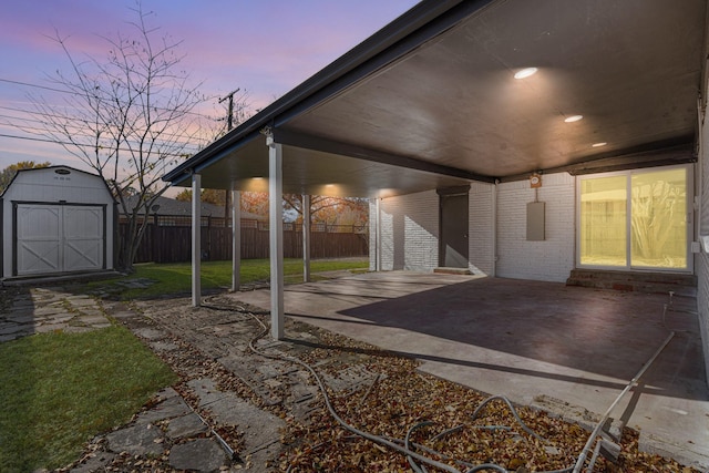 patio terrace at dusk with a storage unit