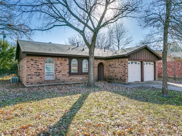 single story home featuring a front yard and a garage