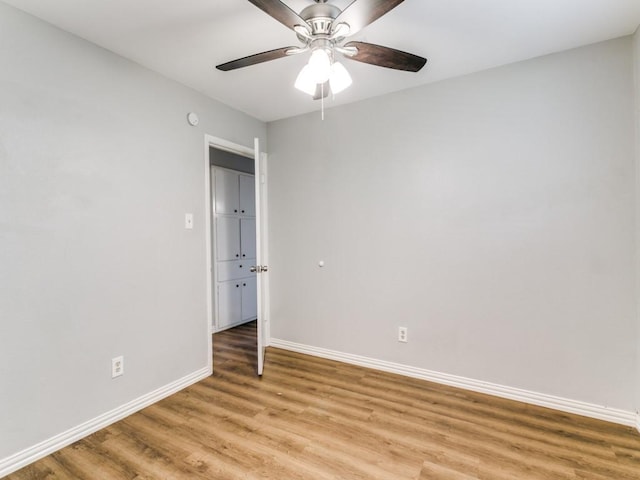 spare room with ceiling fan and light hardwood / wood-style flooring