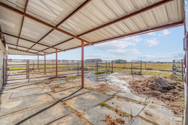 view of patio / terrace with a rural view and an outdoor structure