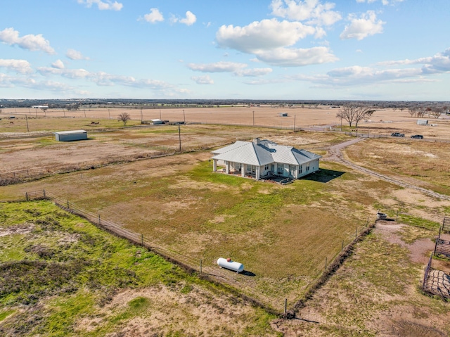 birds eye view of property with a rural view