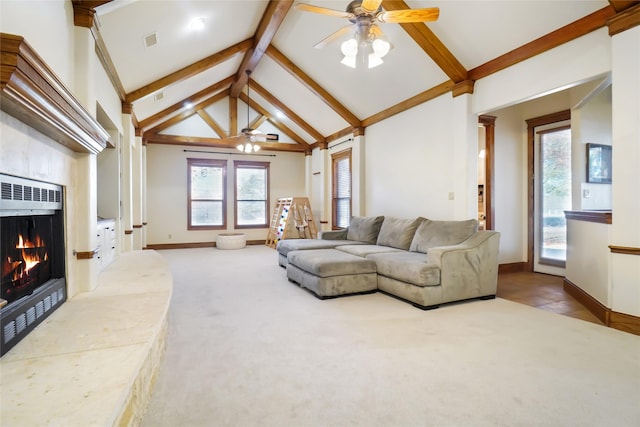 carpeted living room featuring beamed ceiling, ceiling fan, a tile fireplace, and high vaulted ceiling