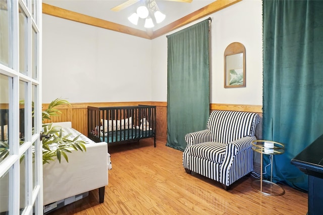 bedroom featuring wood-type flooring and ceiling fan