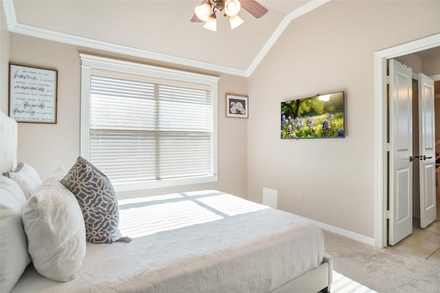 bedroom featuring light carpet, crown molding, ceiling fan, and lofted ceiling