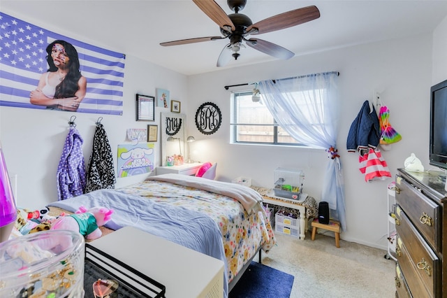 bedroom with ceiling fan and light carpet