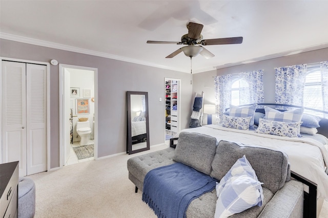 bedroom featuring light carpet, ceiling fan, ornamental molding, connected bathroom, and a closet