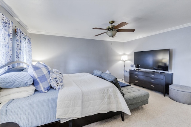 carpeted bedroom with ceiling fan and crown molding