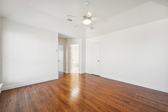 spare room with ceiling fan and dark hardwood / wood-style floors