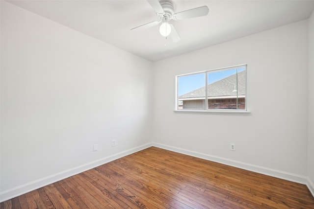 unfurnished room with ceiling fan and hardwood / wood-style flooring