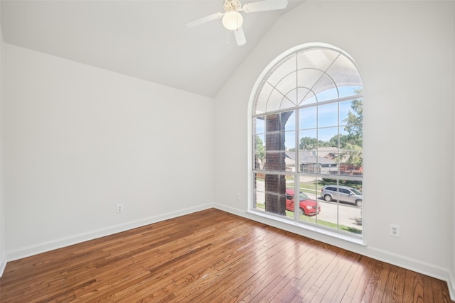 unfurnished room featuring high vaulted ceiling, hardwood / wood-style floors, and ceiling fan