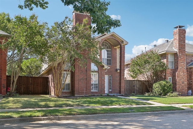 view of front of home featuring a front yard