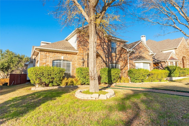 view of front facade featuring a front yard