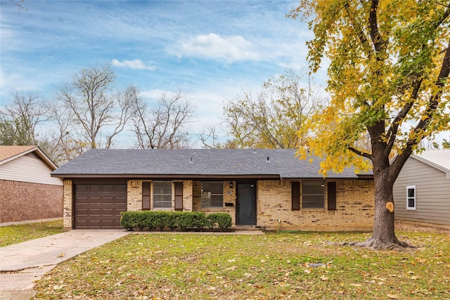 single story home with a front yard and a garage