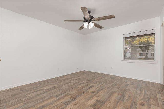 empty room featuring hardwood / wood-style floors and ceiling fan