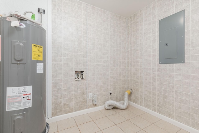 interior space featuring washer hookup, tile patterned floors, electric dryer hookup, water heater, and electric panel