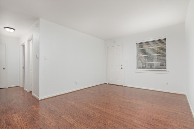 spare room featuring hardwood / wood-style flooring