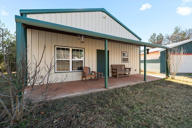 rear view of property featuring a patio