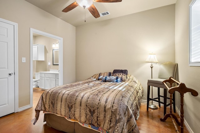 bedroom with ceiling fan and connected bathroom