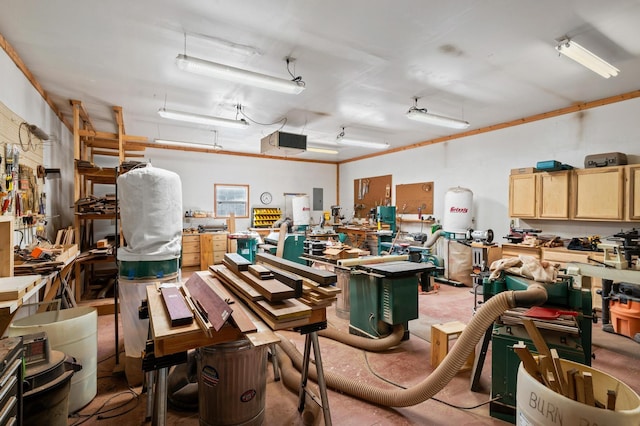 garage featuring a workshop area and electric panel