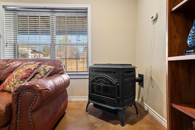 sitting room featuring a wood stove