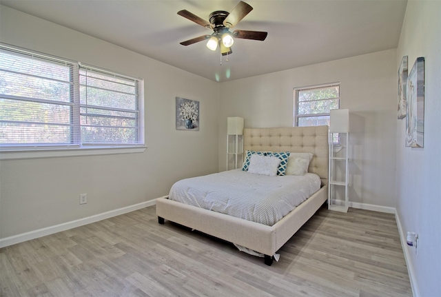 bedroom featuring ceiling fan and light hardwood / wood-style flooring