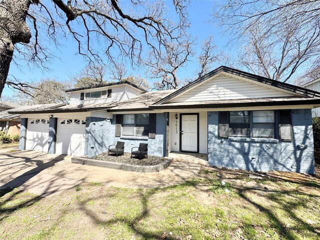 front of property with a garage