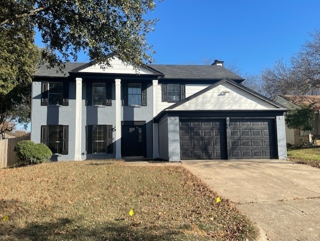 view of front of house featuring a garage and a front yard